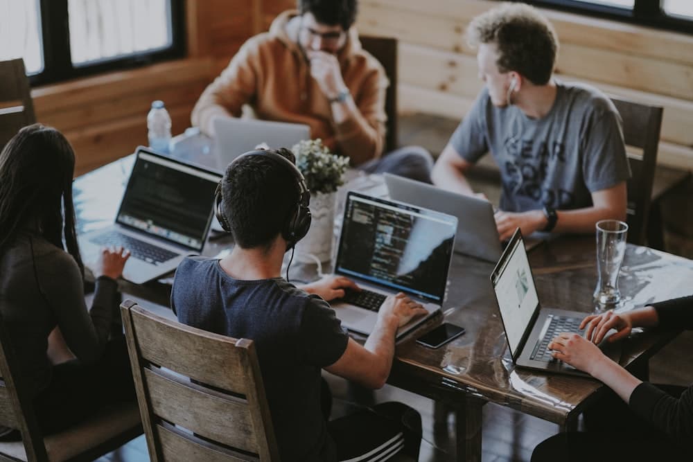 People studying and working together at a cafe